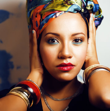 beauty bright african woman with creative make up, shawl on head like cubian woman