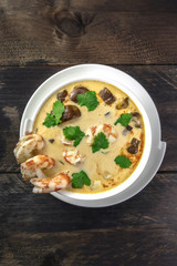 Tom Yam, traditional Thai soup with shrimps and mushrooms