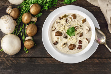 Plate of mushroom soup with champignons, cremini, and parsley