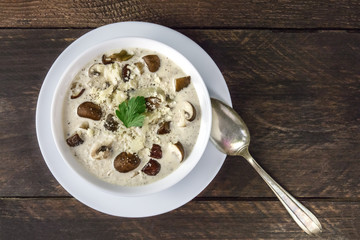 Plate of mushroom soup, top view with copy space
