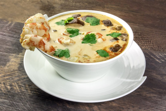 Tom Yam, traditional Thai soup with shrimps and mushrooms, closeup