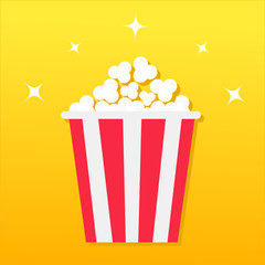 Popcorn box. Movie Cinema icon in flat design style. Pop corn icon. Yellow gradient background. Shining stars. Flat design.