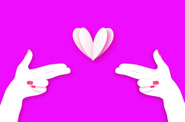 Woman hand making shape of pointed gun. Origami Female holding Two fingers like a revolver. Love Bang. White Heart Shot in paper cut style. 2 hands.Valentine day. Romantic Holidays.14 February.