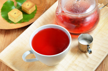 cup of hibiscus tea and cookies      