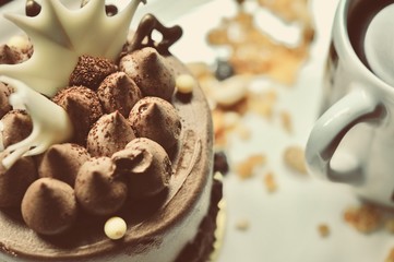 chocolate cake on the white plate with a cup of coffee, food macro photography decoration concept for new year party.