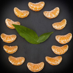 photo of a mandarin clock on a black background