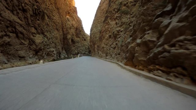 POV Driving through Todra Gorge gap in Morocco desert landscape &ndash; steadyshot in 4K