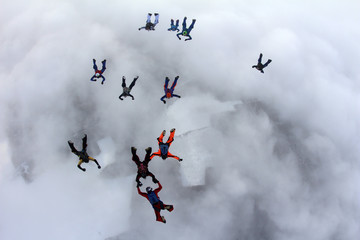 The group of skydivers in the sky.