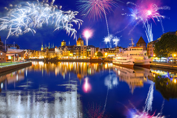 Fototapeta na wymiar New Year fireworks display over Motlawa river in Gdansk, Poland