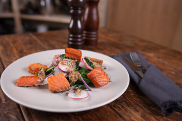 Salad with grilled salmon and  radish 