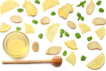 healthy background. sliced ginger, honey and lemon isolated on white background top view
