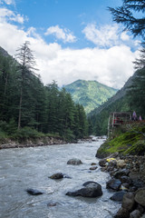 Fototapeta na wymiar View of River in the Midst of the Himalayas at Kasol, India