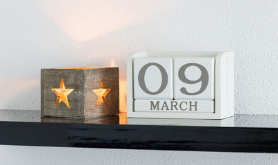 White block calendar present date 9 and month March