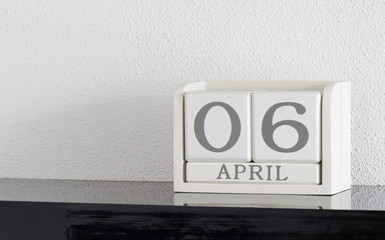 White block calendar present date 6 and month April
