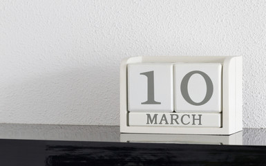 White block calendar present date 10 and month March