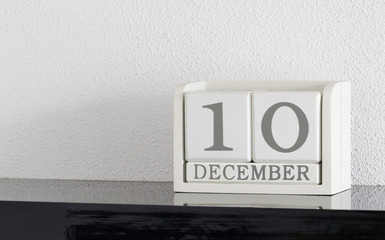 White block calendar present date 10 and month December