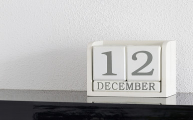 White block calendar present date 12 and month December