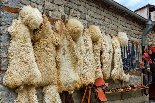 View over local street in Lahich, shop with bags, souvenirs and herbs. Traditional caucasus sheepskin fur