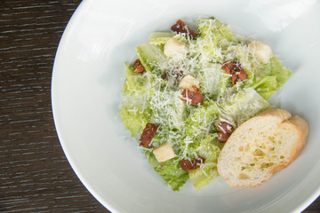 Ceasar salad in white plate