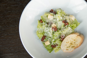 Ceasar salad in white plate