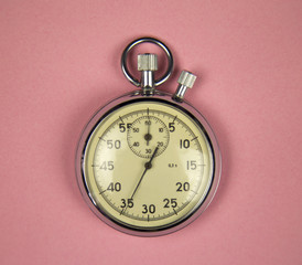 Vintage stopwatch on Pink background