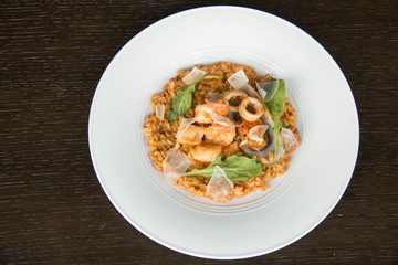  Risotto with seafood on white plate