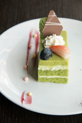  Green tea cake on white plate