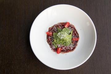  beef carpaccio with sliced on white plate
