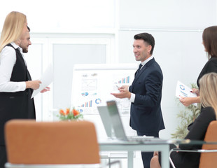 businessman makes a presentation to his business team