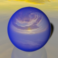 Reflecting blue globe with image of sunset sky