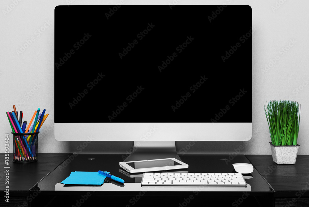 Poster computer on a table in an office