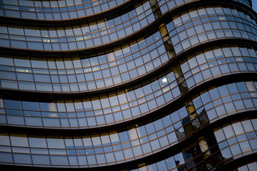 Corporate concept - detail of modern glass building in Milan