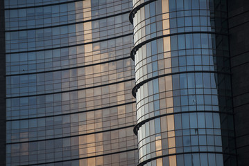 Corporate concept - detail of modern glass building in Milan