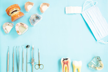 dentist tools and prosthodontic on color background, flat lay, top vipw.