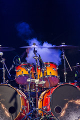 Drummer at a concert in a cloudy smoke.