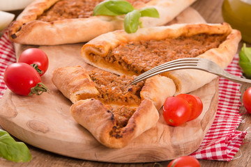 Turkish pide pizza with meat and onion. 
