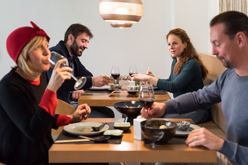 Friends in elegant oriental restaurant