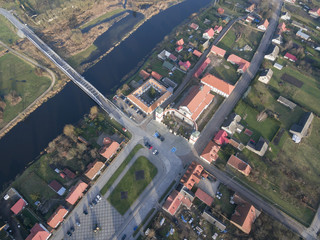 Aerial view of Tykocin city, Big Market, Church of Holy Trinity and bridge over Narew river