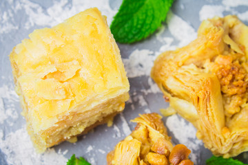 baklava turkish traditional delight on a dark wood background. toning.