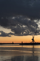 Stormy clouds of contrasting color over the harbour
