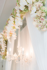 Floral and chandelier wedding backdrop