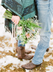 Woman holding pastel coloured bouquet