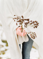 hands holding branch