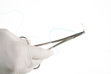 NEEDLE HOLDER AND SUTURE