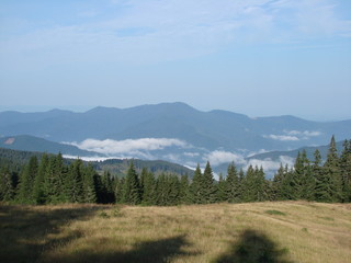 Panorama of the Carpathian mountains, covered with clouds.