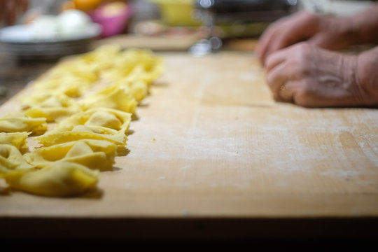 Grandmother preparing the Pumpkin Tortelli of Mantua, the original and traditional recipe from North of Italy