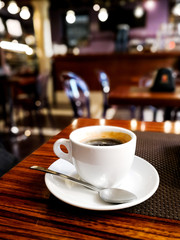 wonderful white cup of hot coffee on table