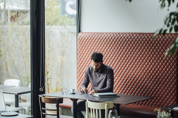 Feelance Businessman Working from Restaurant