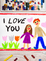 Photo of colorful drawing: couple in love and inscription I LOVE YOU
