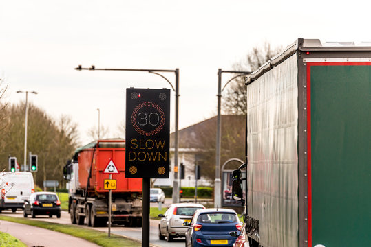 Flashing 30 MPH Speed Limit Check Smart Device on UK Motorway Road